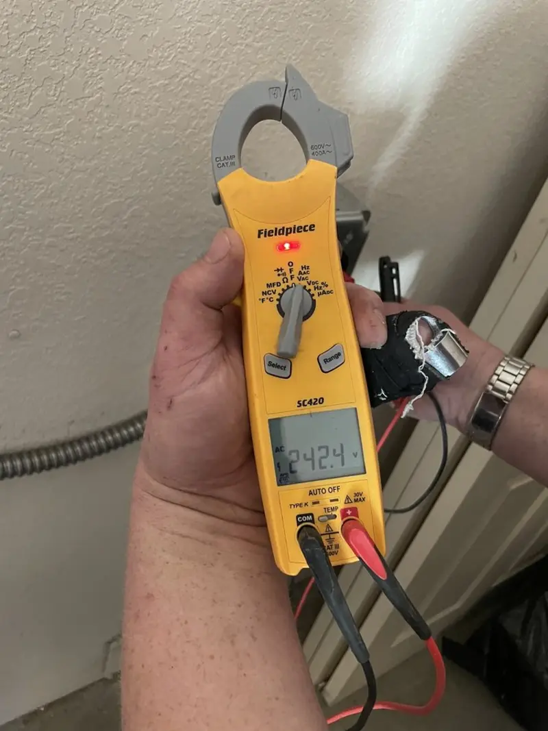 Voltage testing with clamp meter during Recessed Lighting Installation in Waycross